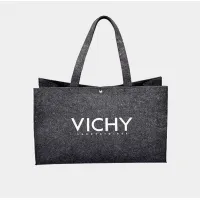 Picture A bag made of felt, closed with a snap