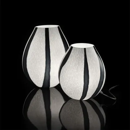 Picture A unique glass lamp with black vertical stripes