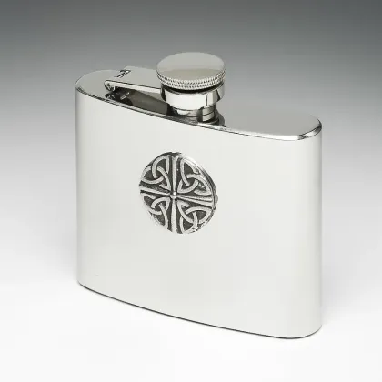 Picture A unique whiskey flask decorated with a tin disc with a trinity knot