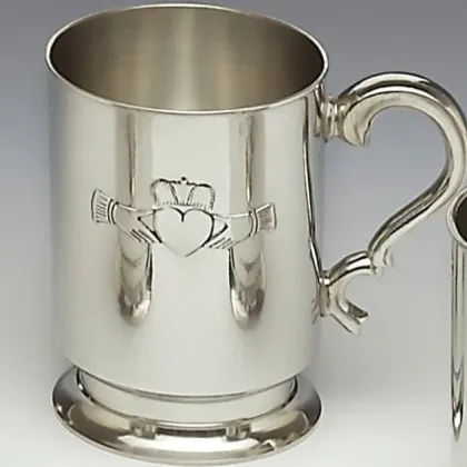 Picture A unique pewter mug decorated with a Claddagh pattern