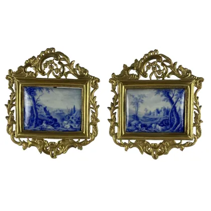 Picture A pair of 18th century enamel plaques with figures and gold frames