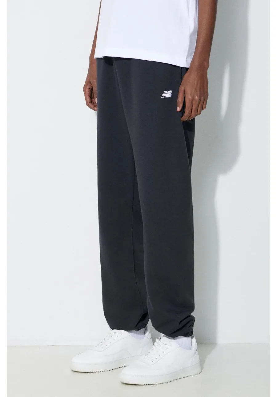 obrazek 1 New Balance spodnie dresowe Essentials French Terry Jogger kolor czarny gładkie MP41519BK