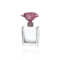 Picture Stylish perfume bottle with a rose-decorated cap
