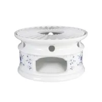 Picture White porcelain tea heater from Germany decorated with a blue floral pattern - Tettau
