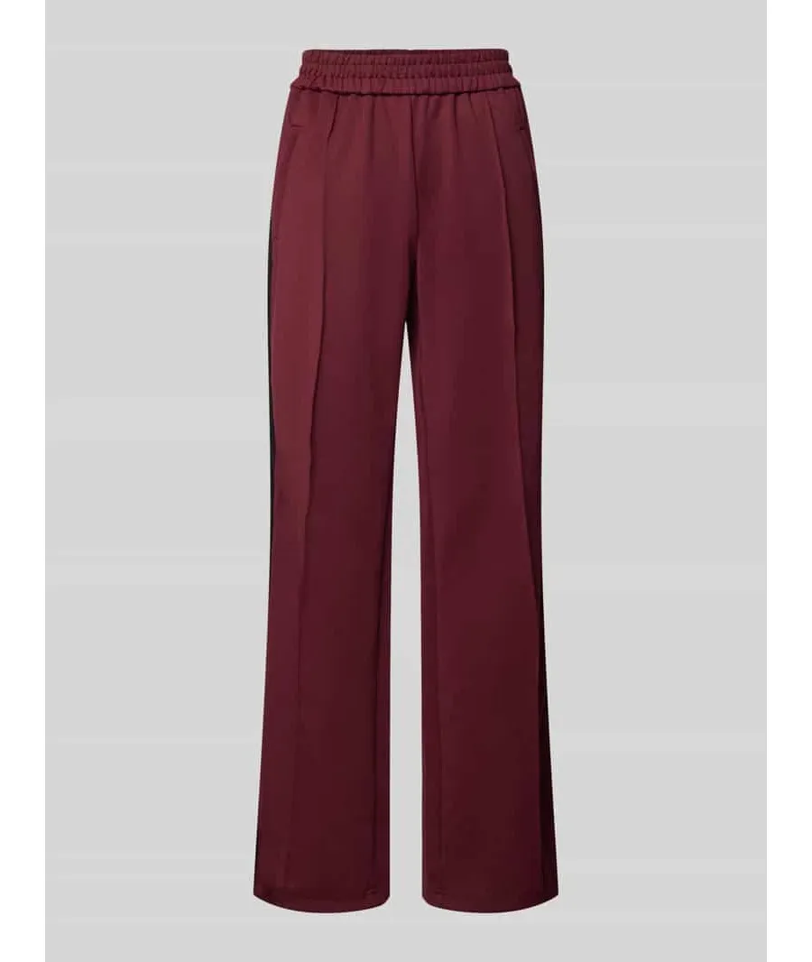 obrazek 1 Spodnie typu track pants o luźnym kroju z paskami w kontrastowym kolorze model ‘WARM UP X’