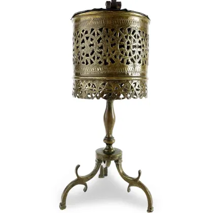 Picture An elegant brass cauldron with a three-legged base from the 19th century