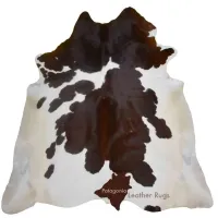 Picture Dark brown/white exotic cowhide rug