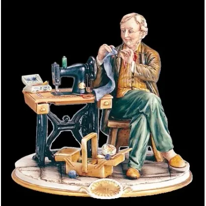 Zdjęcie Oryginalna figurka krawca z porcelany