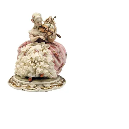 Zdjęcie Porcelanowa figurka kobiety grającej na skrzypcach