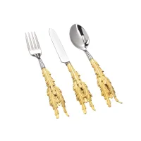 Zdjęcie Oryginalne sztućce stalowe z uchwytem z pozłacanego brązu