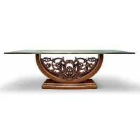 Picture Rectangular antique table with a glass top and a carved base