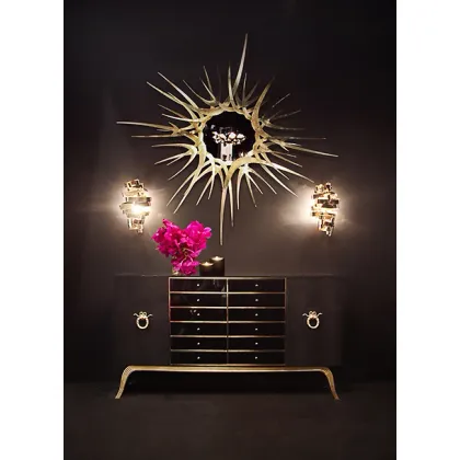 Picture A unique and modern chest of drawers finished with leather and gold