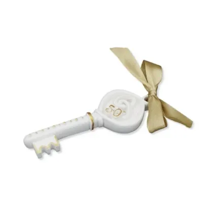 Picture Stylish sculpture - a key of fortune for the 50th wedding anniversary with a gold ribbon