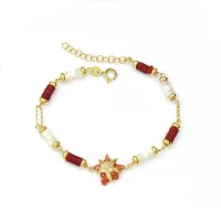 Picture Silver bracelet plated with 18-carat gold, with bamboo coral and white mother of pearl. Finished with white zircon and red enamel