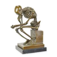 Picture A unique bronze sculpture of a pensive skeleton