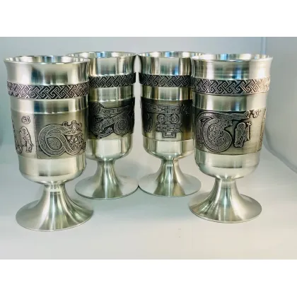 Picture A luxurious set of four beer mugs depicting letters from the Book of Kells