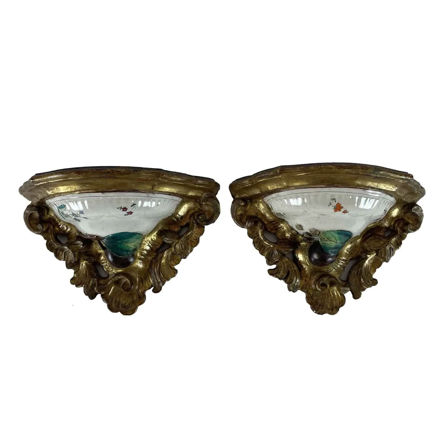 A pair of antique gilded majolica shelves from the 18th century