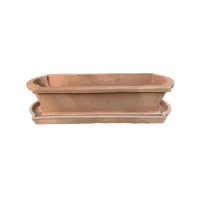Picture A solid clay pot with a base for stylish gardens