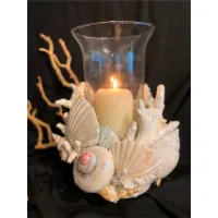 Picture A unique candlestick in the shape of sea shells and coral in the color of mother of pearl