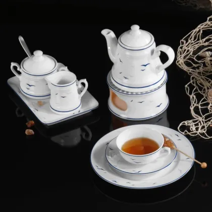 Picture A stylish, classic porcelain coffee pot from Germany decorated with a subtle bird motif - Tettau