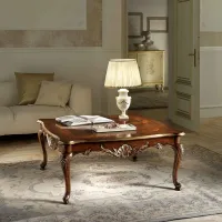Picture Stylish small square table with a wooden top and gilded details