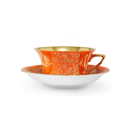 Zdjęcie Filiżanka do herbaty Windsor ze spodkiem z porcelany w kolorze pomarańczowym zdobiona złotymi kwiatami – Leander