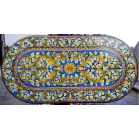 Picture A prestigious garden table top made of lava, decorated with a plant ornament - Ceramiche Valchida