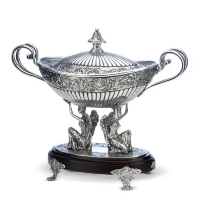 Picture A unique oval bowl made of pewter on a decorative base