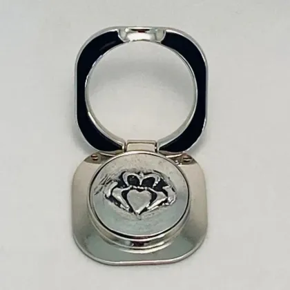 Picture Stylish pewter mobile phone holder decorated with a Claddagh pattern