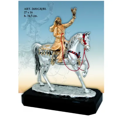 Zdjęcie Piękna figura jeźdzca na białym koniu