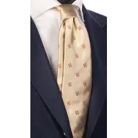 Picture A unique beige tie with orange and red micro patterns