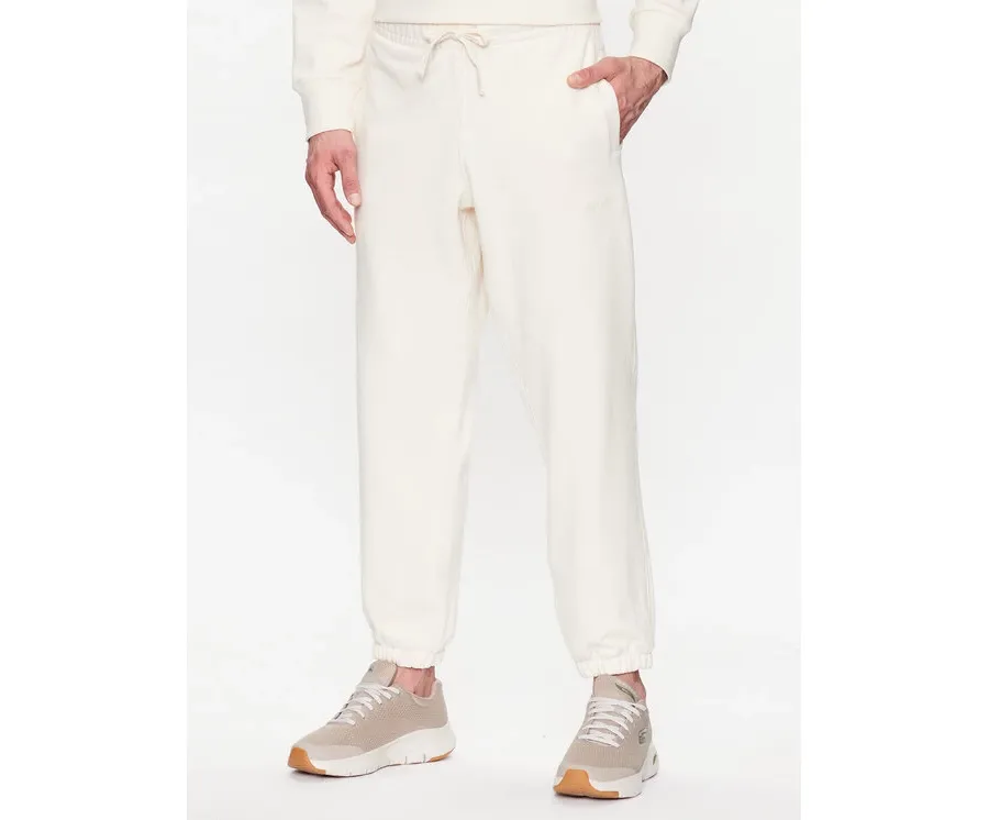 obrazek 1 New Balance Spodnie dresowe MP23551 Écru Relaxed Fit