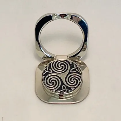 Picture A unique Pop Socket mobile phone holder made of pewter decorated with a Celtic spiral pattern