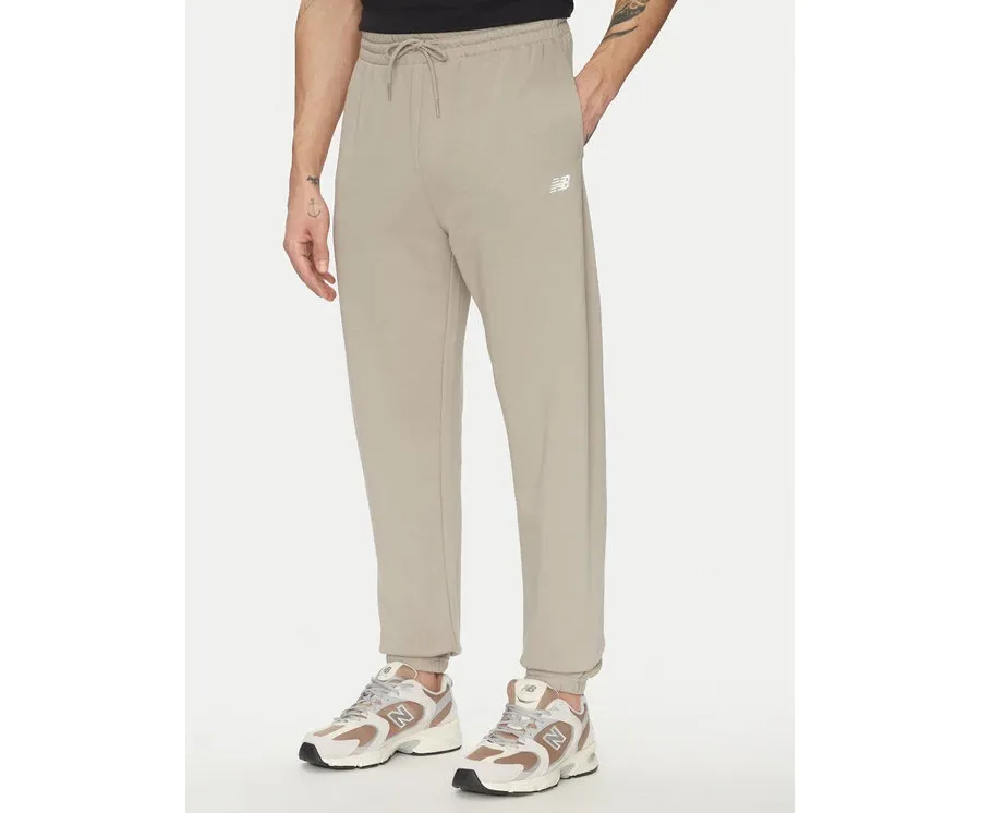 obrazek 1 New Balance Spodnie dresowe Essentials MP41519 Beżowy Relaxed Fit