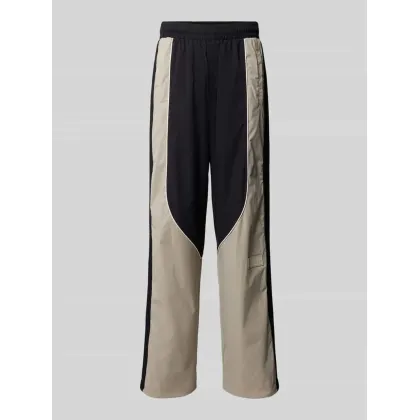 Zdjęcie Spodnie treningowe z szeroką nogawką i naszywką z logo model ‘TRAIN 7.0’