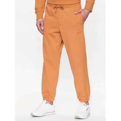 Zdjęcie New Balance Spodnie dresowe MP23551 Pomarańczowy Relaxed Fit