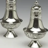 Picture A unique set of large salt and pepper containers made of Irish tin