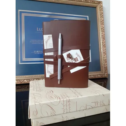 Picture Elegant brown leather notebook with a pen - Legatoria Koine
