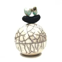 Picture A beautiful tiny ball with a bird made of ceramics - a perfect gift for a special occasion