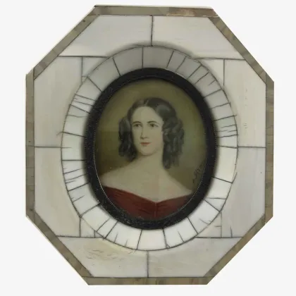 Picture Portrait of a girl in an ivory octagonal frame with an inset of an oval miniature framed by a small bronze frame
