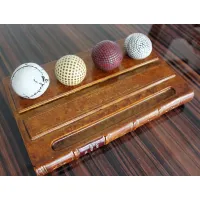 Zdjęcie Elegancka podstawka na długopis z historią golfa - wzór książki