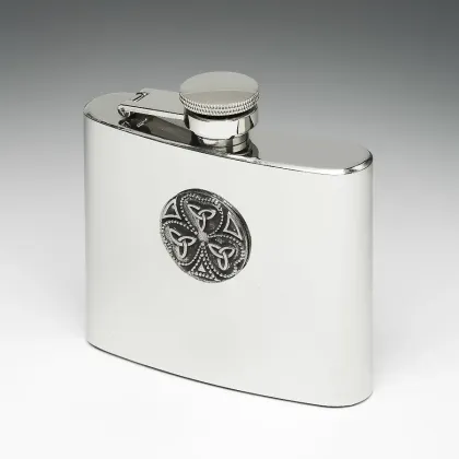Picture A unique hip flask decorated with a tin disc with a clover and a trinity knot