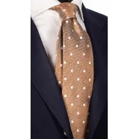 Picture A representative light brown men's tie with white polka dots with a linen effect