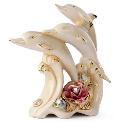 Picture Fantastic ceramic table decoration with dolphins