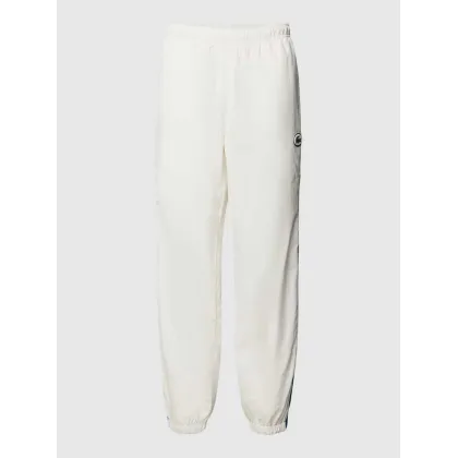 Zdjęcie Spodnie dresowe o kroju regular fit z naszwyką z logo