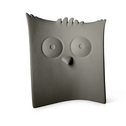 Picture An amazing decorative figurine of an owl made of ceramics