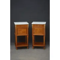 Picture A pair of mahogany bedside tables, each with a marble top with cross-section drawers and inlaid and crossed doors