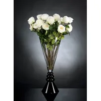 Picture A delightful tall glass vase with a bouquet of white roses