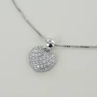 Picture Silver necklace with a convex heart with zircons
