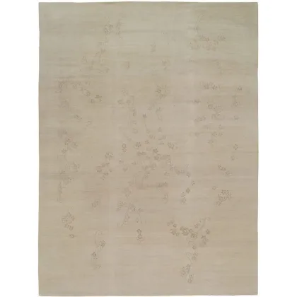 Zdjęcie Kremowy wełniany dywan z delikatnym motywem roślinnym